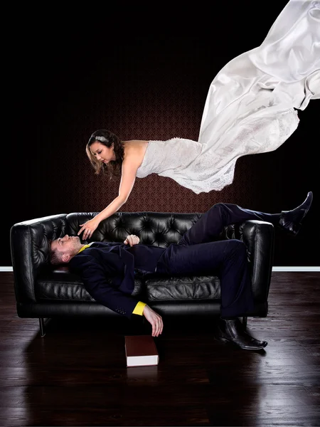 Man dreaming on a couch of a woman