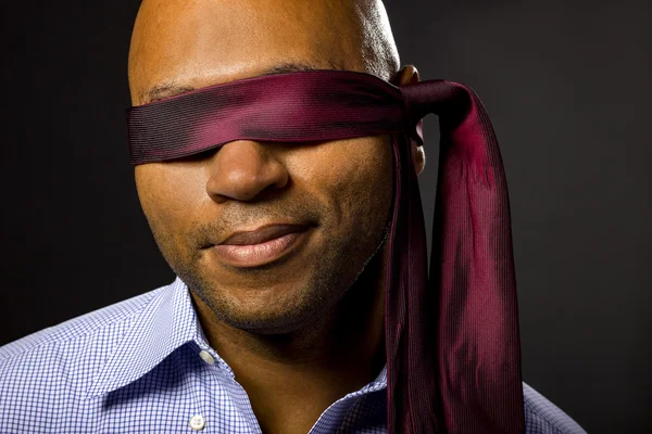 Black businessman blindfolded