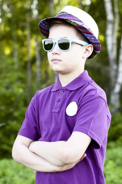 Boy with glasses  hat summer day  woods, outdoors resting one confident little man fashion style concept idea, shirt