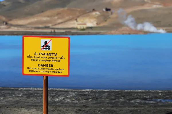 A warning sign near the waters of Bjarnarflag Geothermal Power Station