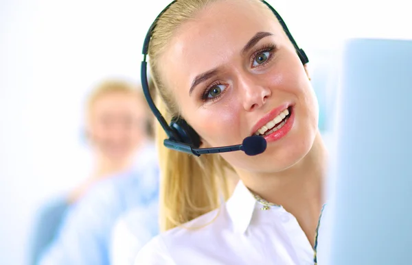 Attractive positive young businesspeople and colleagues in a call center office