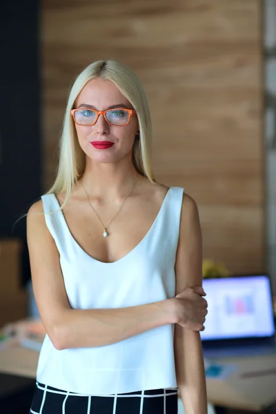 Portrait of an executive professional mature businesswoman sitting on office