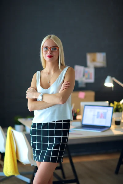 Portrait of an executive professional mature businesswoman sitting on office