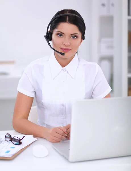 Close-up portrait of a customer service agent sitting at office