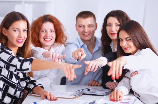 Business people group team point finger at you