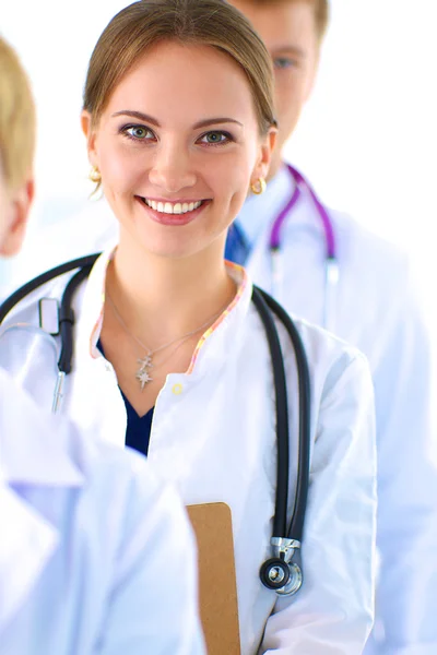 Attractive female doctor with folder in front of medical group