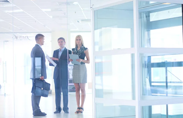 Successful business woman standing with her staff