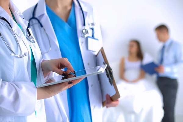 Young woman doctor holding a tablet pc