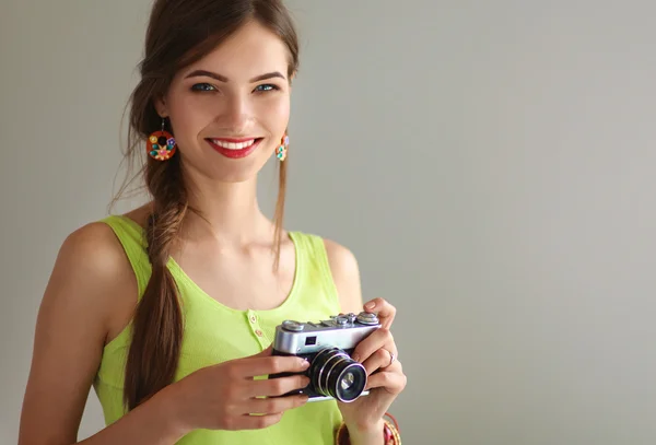 Portrait of a young beautiful photographer woman on the table