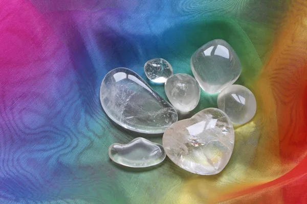 Clear healing crystals on rainbow chiffon