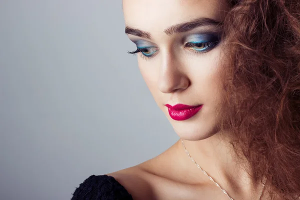 Fashion capture beautiful bright girl with bright makeup, portrait closeup