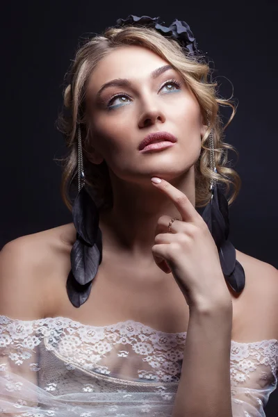 Beautiful young sexy elegant sweet girl in the image of a bride with hair and flowers in her hair , delicate wedding makeup