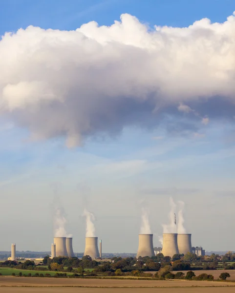 Cooling towers spew clouds into the atmosphere
