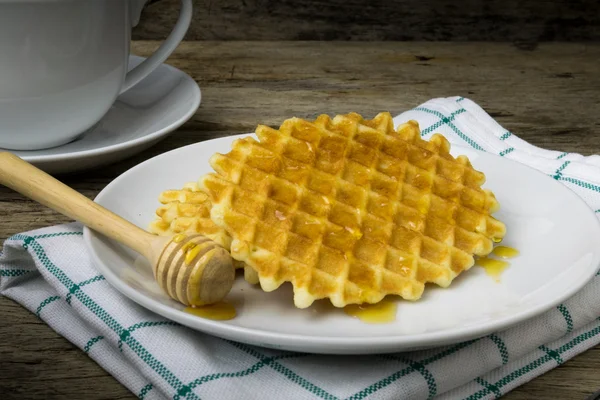 Waffle with a cup of Coffee and honey