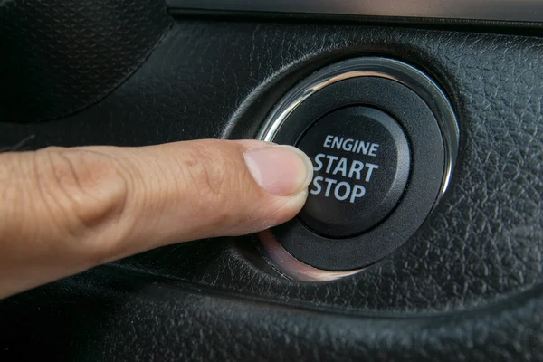 Car driver starting the engine