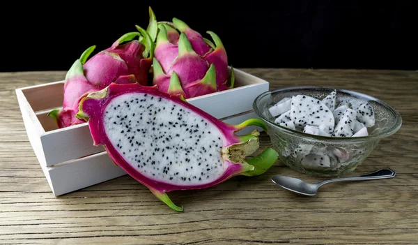 Dragon Fruit in the box. Dragon Fruit on a wooden table. Selecti