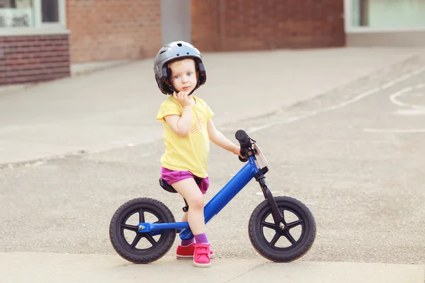 Girl toddler riding a bike