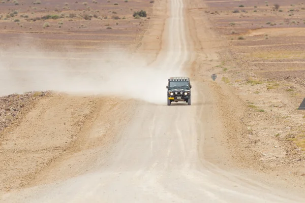 SUV in the scenic road C12 to Fish River Canyon, Namibia