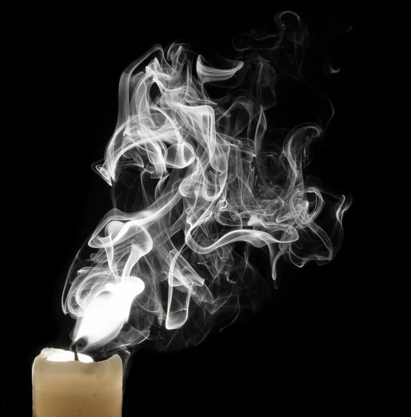 The smoke from the candle