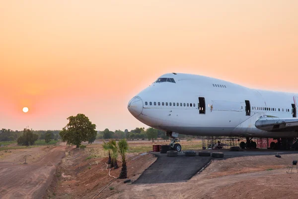 Airplane wait for maintenance at sunrise in outdoor