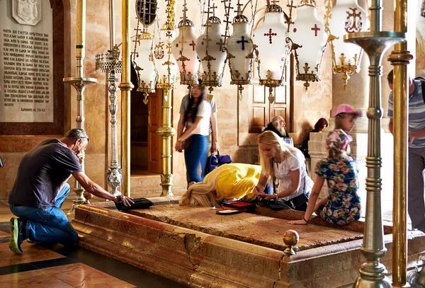 Prayers at the Stone of Anointing in the Holy Sepulchre Church