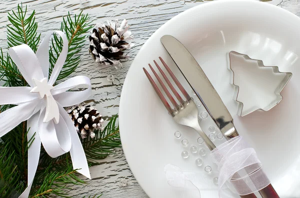 Festive christmas dinner tableware with white plate