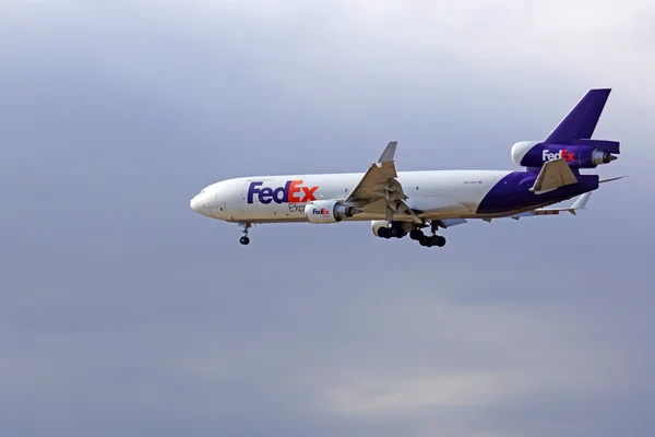 Jet FedEx airplane landing at Ontario International Airport outside of Los Angeles, California