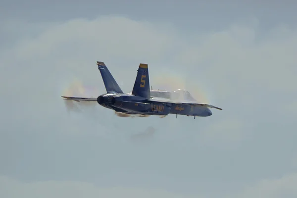 Jet Airplane Blue Angels F-18 Hornet breaking sound barrier at 2015 Miramar Air Show in San Diego, California