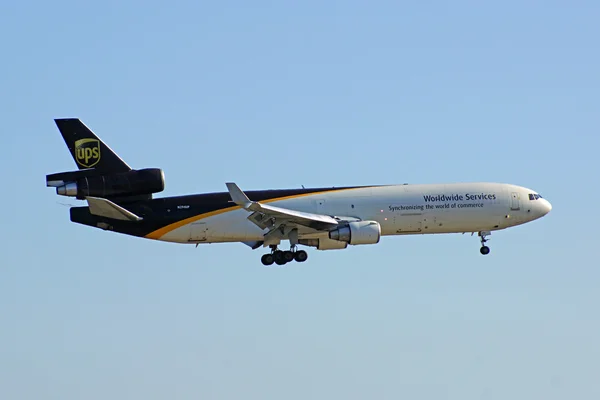 Airplane UPS MD-11 Freight Jet landing at Los Angeles area hub at Ontario, California airport