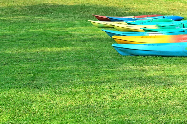 Canoeing the many colorful arranged on the lawn. From water to dry