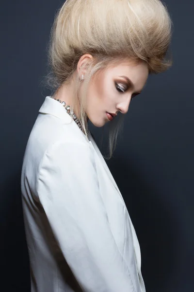 Beauty Portrait. Hairstyle. Fashion Beauty Model with Blond Hair. Perfect Creative Make up and Hair Style.