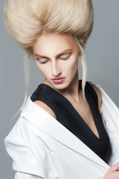 Beauty Portrait. Hairstyle. Fashion Beauty Model with Blond Hair. Perfect Creative Make up and Hair Style.