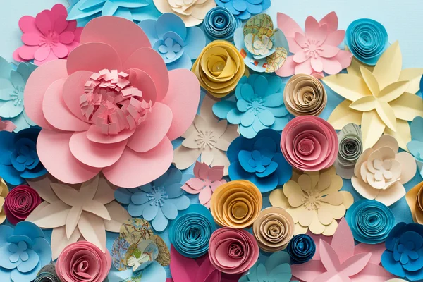 Vintage paper flowers. Pink, Blue, yellow and White flowers paper background pattern lovely style. Rose made from paper.