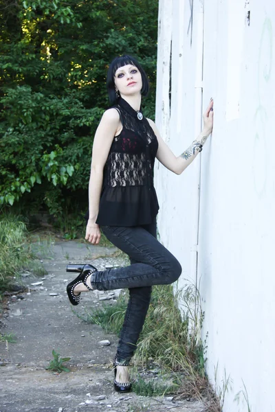 Pretty goth girl on abandon rail station