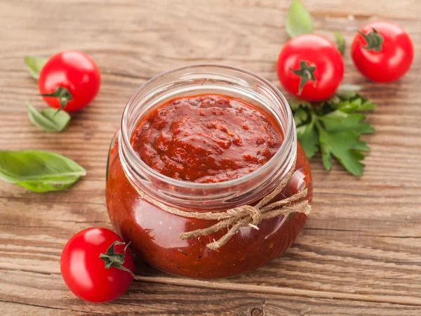 Tomato sauce with basil in glass jar