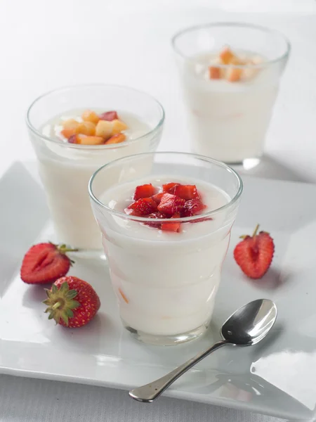 Glasses with fruit and berry yogurt