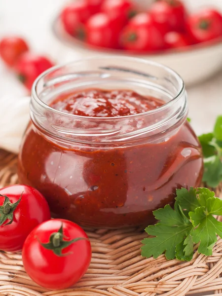 Tomato sauce with basil in glass jar