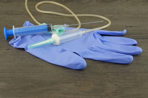 Disposable infusion set, syringe and glove