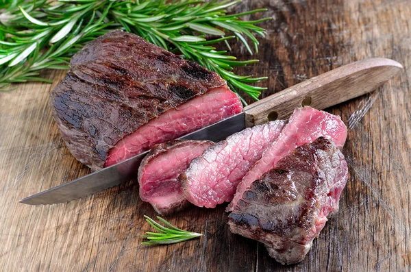 Beef steak cut with a knife