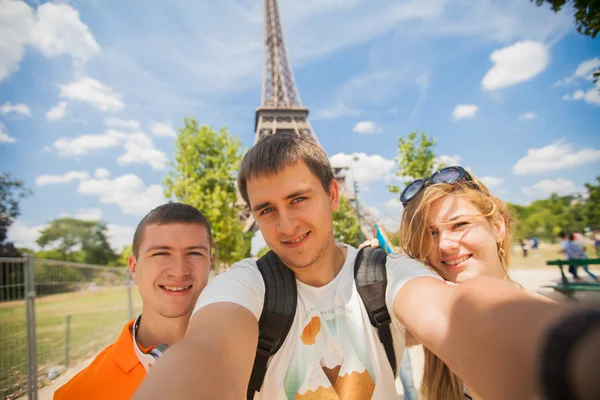 Four friends in Paris together, having fun