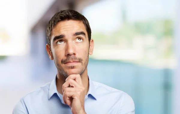 Close up of a businessman wondering