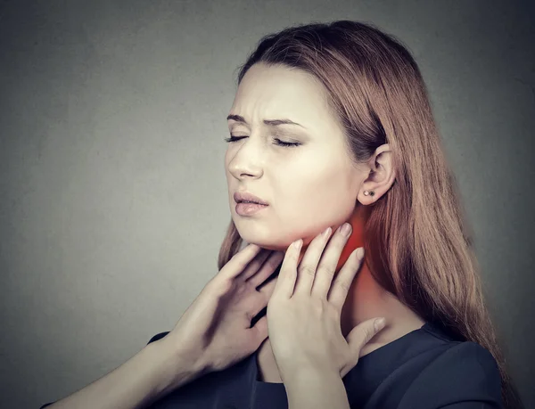 Girl with sore throat neck colored in red. Sick woman having pain in throat