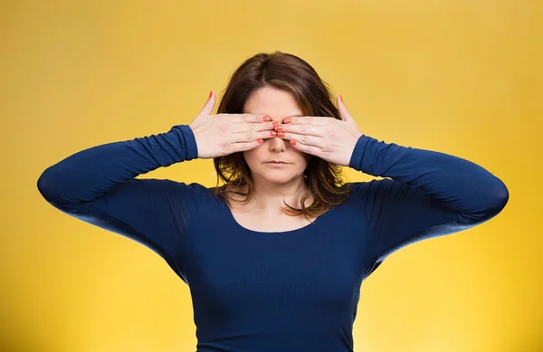 Woman, closing, covering eyes with hands can't look, hiding. See no evil concept