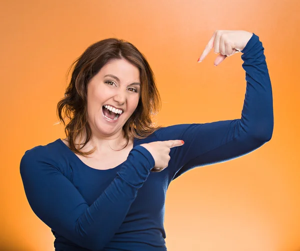 Woman flexing muscles showing, displaying her strength