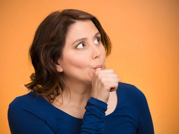 Woman with finger in mouth, sucking thumb