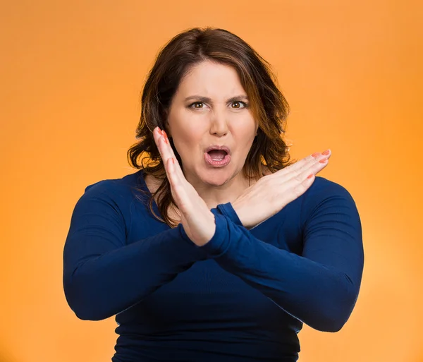 Woman with X gesture to stop talking, cut it out