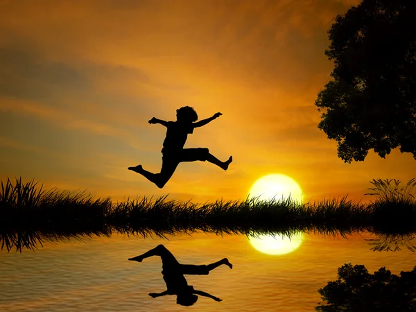 Happy boy, teenager jumping in water, over lake with sunset background