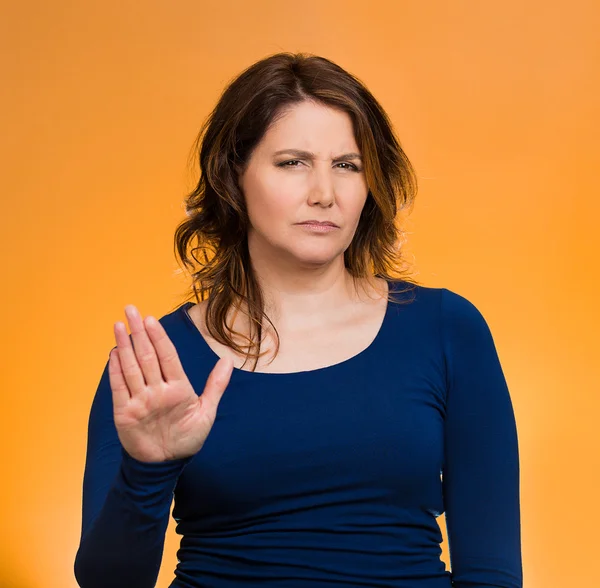 Annoyed woman with bad attitude, giving talk to hand gesture