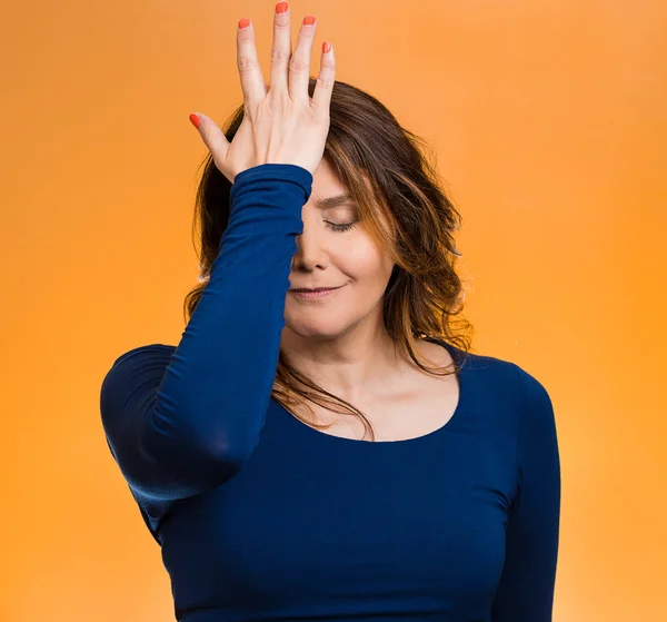 Woman realizes mistake, regrets, slapping hand on head to say duh