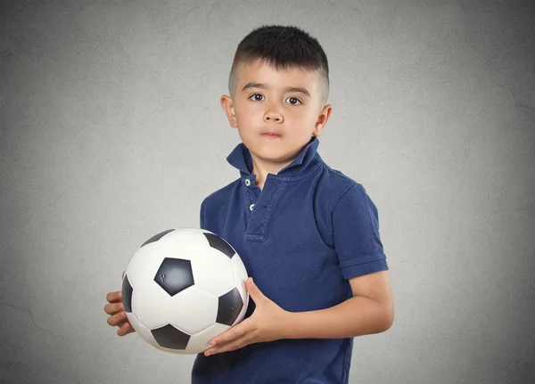Boy holding football ball